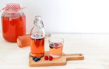 Homemade fermentation. Kombucha tea slightly alcoholic, lightly effervescent drink with berries. Copy space