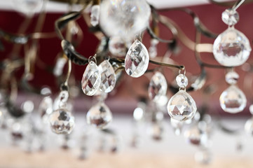 Round transparent hanging crystals close-up
