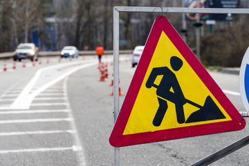 road signs informing about road repair, car signs for traffic control, road marking