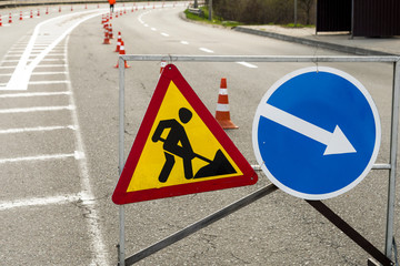 road signs informing about road repair, car signs for traffic control, road marking