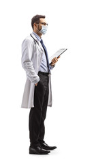Male doctor with a protective face mask holding a clipboard