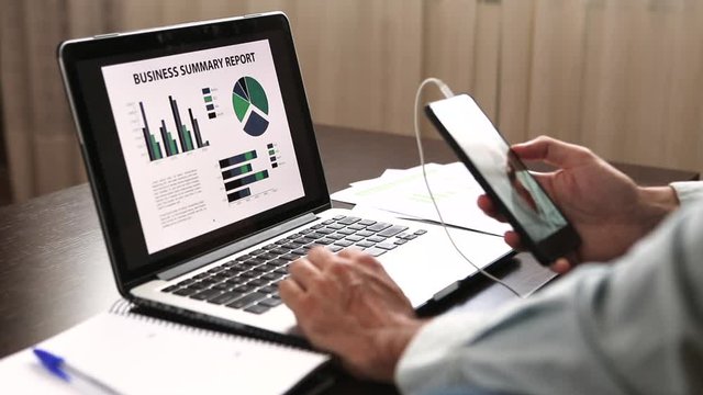 Man teleworking and making a video conference online with his partners to analyze the economic evolution of his company. Finance economic and business impact crisis by coronavirus