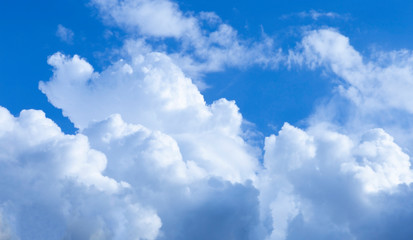 Obraz na płótnie Canvas White fluffy clouds in the blue sky.