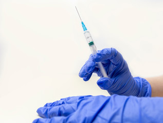 Syringe, medical injection in the doctors hand.