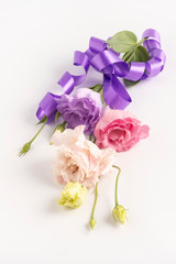 Elegant bouquet of eustoma flowers with lilac trim