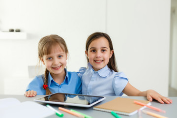 Fototapeta premium Learning from home, Home school kid concept. Little children study online learning from home with laptop. Quarantine and Social distancing concept.