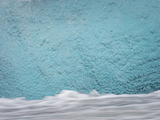 Ice structures on the black lava beach, placed near Jokulsarlon glacier lagoon.
