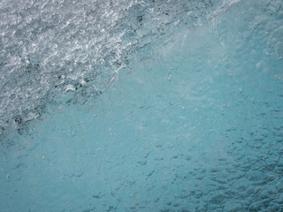 Ice structures on the black lava beach, placed near Jokulsarlon glacier lagoon.