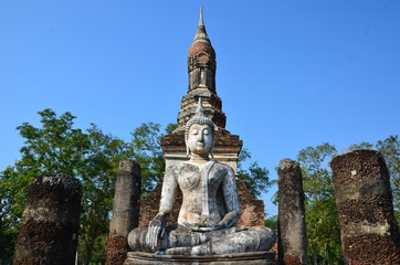 Wonderful white Buddha sitting in front of the chedi of Wat Traphang Ngoen, Sukhothai Historical...