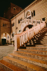 Fototapeta premium evening italian streets in verona. evening italian streets in verona. Ancient buildings and old town streets of Italy