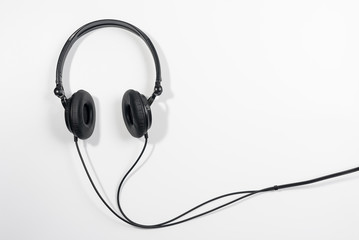 Black electronic headphones isolated on the white background