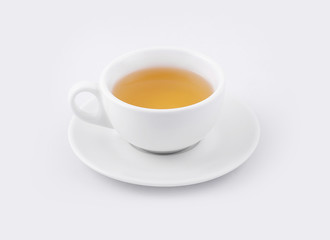 cup of green tea on a white saucer on a white background
