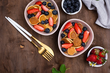 Fototapeta na wymiar Sweet pancake cereals with berries