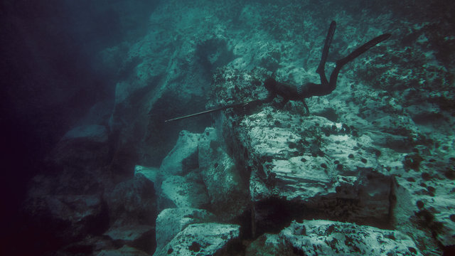 Freediver awaits underwater