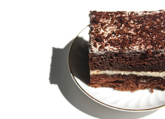 Chocolate brownie cake, dessert with white cream and topping on a light background