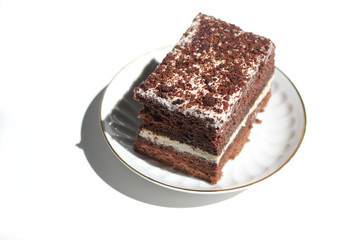 Chocolate brownie cake, dessert with white cream and topping on a light background