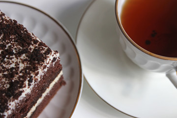 Chocolate brownie cake, dessert with white cream and topping on a light background