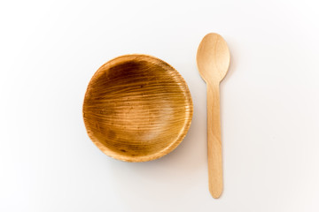 Round wooden bowl made frompalm leaf