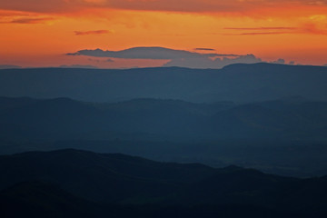 mountains and valleys during dusk