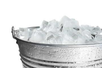 Metal bucket with ice cubes isolated on white © New Africa