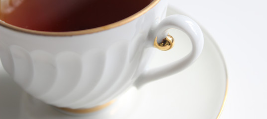 Banner. tea in cup isolated on white background