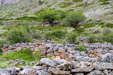 Fototapeta na wymiar Stone remains of old abandoned balkar village in North Caucasus