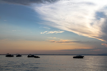 Sunset on the lake in a resort town Peschiera del Garda in the province of Verona, in Veneto, Italy