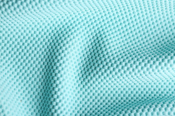 Fototapeta premium Textured light blue fabric as background, closeup