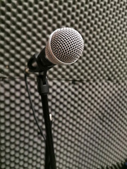 microphone in a recording studio on the background of soundproof paralon panels