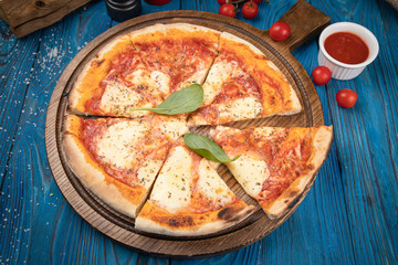 margarita pizza on wooden board 