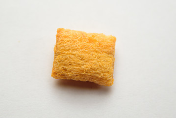 
close-up corn pad with chocolate filling on a white background