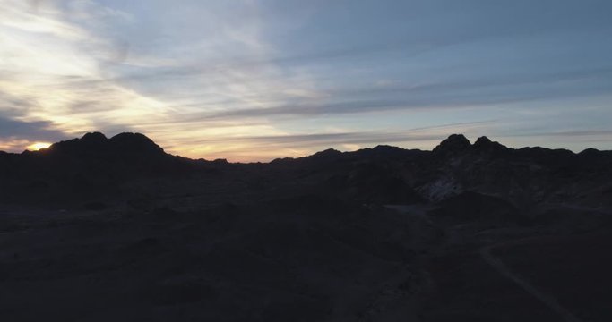 Martian landscape at dusk with beautiful sunset