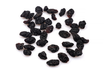Organic Dark raisins isoalted on white background
