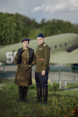 Young adult man and woman in the uniform of pilots of the Soviet Army of the period of World War...
