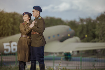 Young adult man and woman in the uniform of pilots of the Soviet Army of the period of World War...