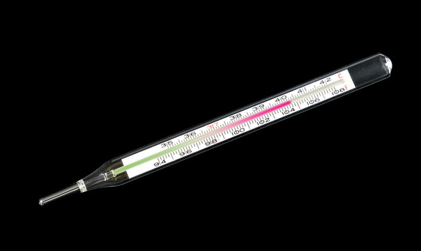 Close up of a glass mercury thermometer showing a feverish temperature of 104 degrees with color scale going to red