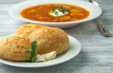 Ukrainian borscht with donuts and sour cream.
