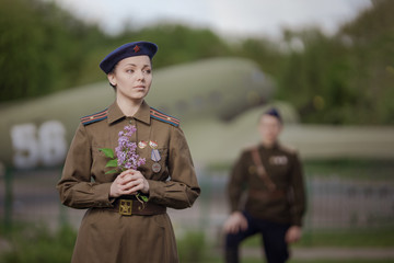 Young adult man and woman in the uniform of pilots of the Soviet Army of the period of World War...