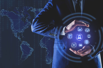 Man demonstrating icons of data management system and world map, closeup