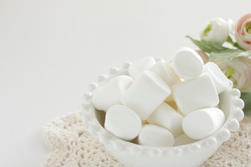 Marshmallow In bowl on white background with copy space