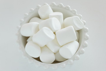 Marshmallow In bowl on white background with copy space