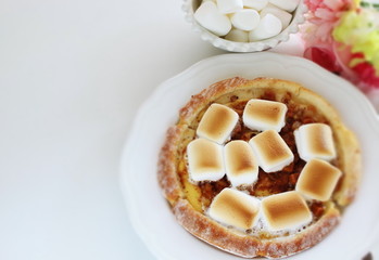 Marshmallow and sugar pizza on dish for sweet food