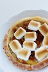 Marshmallow and sugar pizza on dish for sweet food