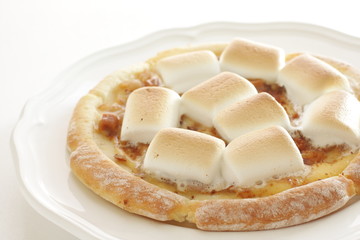 Marshmallow and sugar pizza on dish for sweet food