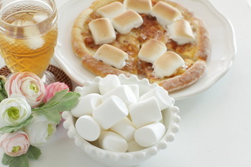 Marshmallow and sugar pizza on dish for sweet food