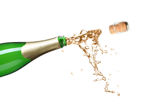 Champagne splashing out of bottle on white background