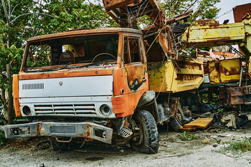 Fototapeta na wymiar Old abandoned rusty wrecked Kamaz car. Kamaz in a landfill.