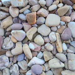 Close up of rounded and polished beach rocks