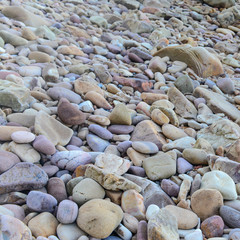Close up of rounded and polished beach rocks