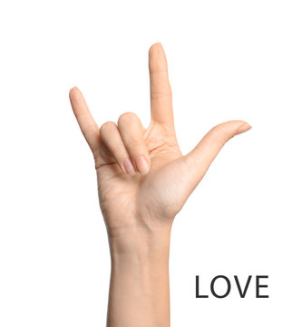 Woman showing word Love on white background, closeup. American sign language